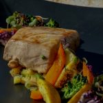 Freshly plated Seabass dinner with grilled Vegetables