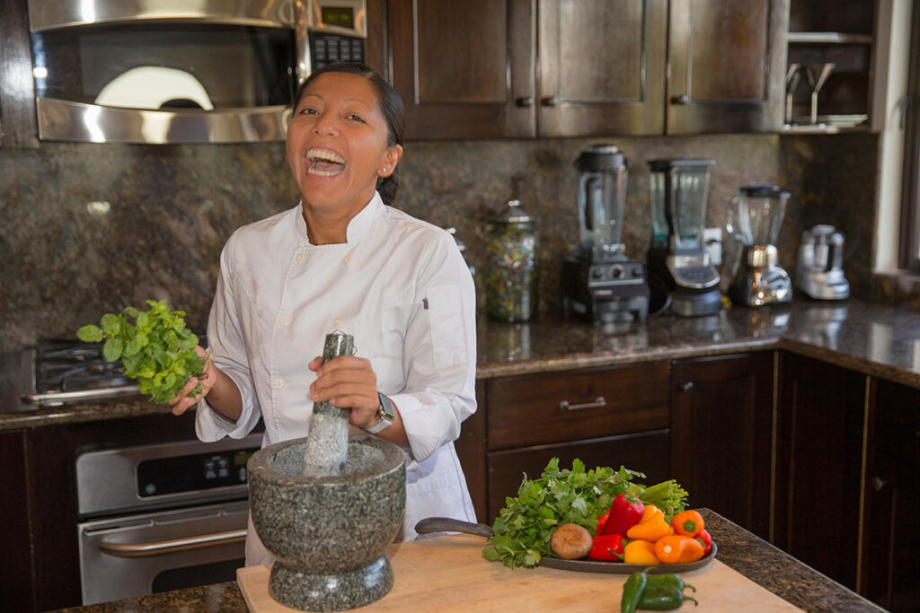 Chef Ari preparing a salad in the kitchen