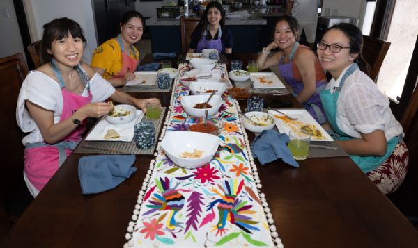 Cooking class students enjoying their meal